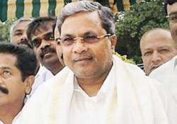 karnataka cm inducts two tainted legislators into ministry