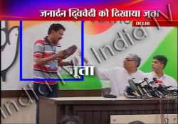 man tries to hurl shoe at congress leader janardan dwivedi