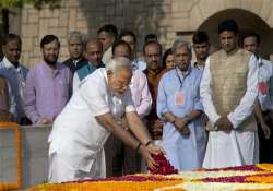 narendra modi pays homage to mahatma gandhi at rajghat