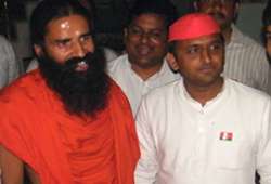 mulayam singh s son akhilesh meets swami ramdev