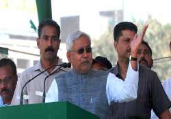 nitish highlights state s role in amu campus cong fumes at him