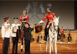 president presents silver trumpet and banner to president s bodyguards