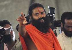 ramdev threatens to disclose names of two leaders having money in swiss banks