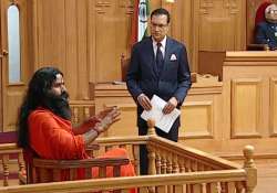 shoe thrown at rahul was because of his karma swami ramdev tells aap ki adalat