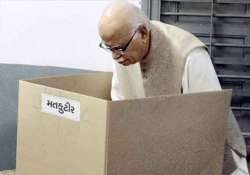 advani casts vote in gujarat parries queries on modi