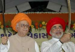 at a glance the complete story of guru advani and chela modi