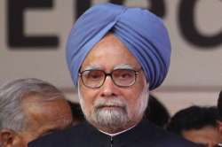 congress congratulates manmohan makes veiled attack on modi