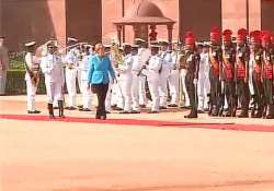 german chancellor merkel given ceremonial welcome