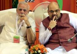 amit shah discusses lalit modi case with pm modi raje to continue as rajasthan cm