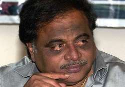 congress in soup as karnataka minister ambareesh caught dancing on video kissing a girl