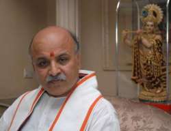 togadia slams mulayam asks him to bring anti conversion law