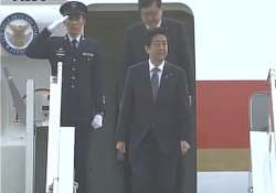 shinzo abe lands in delhi to visit varanasi tomorrow with pm modi