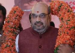 amit shah accuses congress ncp of looting maharashtra