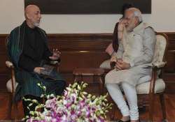 pm modi meets karzai lauds contribution to ties