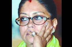 bjp revokes suspension of two raje loyalists