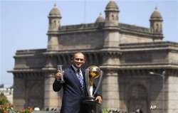 dhoni sports a bald look after wc triumph