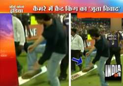 elated shahrukh does a somersault makes a shoe gesture at a fan in pune