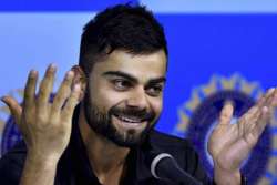 kohli congratulates de villiers on playing 100th test