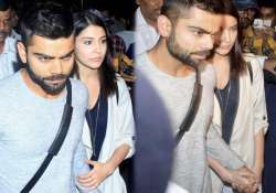 virat s reply to cyber bullies holds anushka s hand as the duo leaves airport