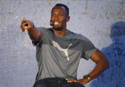 showman bolt wows bangalore crowd but with cricket bat