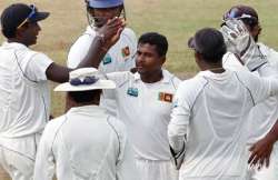 sri lanka s herath shines on rain hit day