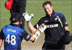 centuries by guptill and latham help new zealnd defeat zimbabwe