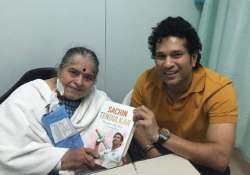 tendulkar presents 1st copy of autobiography to mother