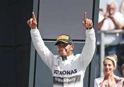 british gp lewis hamilton wins as nico rosberg retires