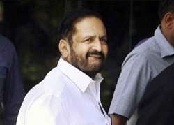 kalmadi s move to travel to olympics evokes sharp reactions