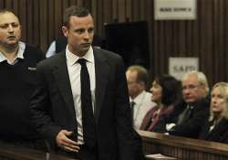 pistorius enters courtroom for start of trial.