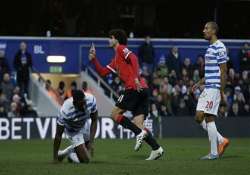 man united beats struggling qpr 2 0 in premier league