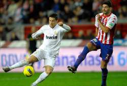 madrid beats sporting gijon 3 0 in spanish league