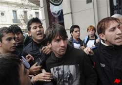 schoolboy throws punch at messi