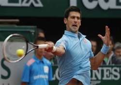 djokovic sharapova reach 2nd round at french open