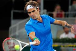 federer rallies past raonic nadal wins in madrid