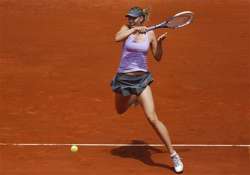 sharapova rallies to avoid early exit at madrid