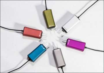 dart a tiny laptop charger will even juice up your phone at the same time