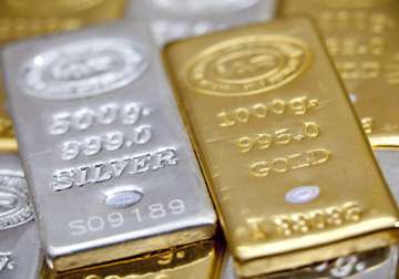 gold rebounds on fresh buying silver plunges