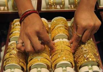 gold recovers on low level buying silver falls