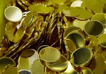 gold remains up on hectic buying global cues