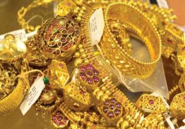 gold tumbles by rs 340 on fall in demand global cues