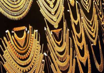 gold eases on reduced jewellery offtake silver declines