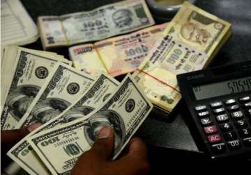 rupee gains 35 paise against dollar in early trade