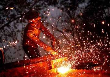 industrial production growth slows to 1.7 in december
