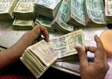 rupee trims initial gains up 2 paise against dollar