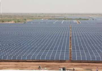 softbank wins ntpc bid for first solar project in india