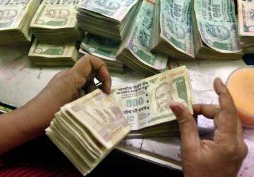 rupee extends gains against dollar up 8 paise at 63.57