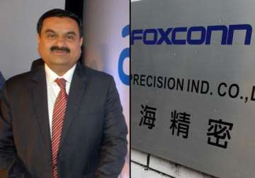 adani may make iphones in india in talks to form jv with foxconn