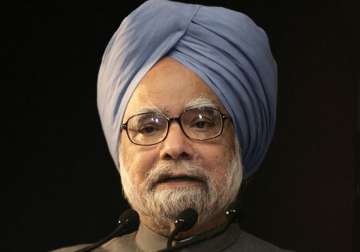 manmohan promises overhaul of corporate and commercial laws