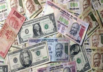 rupee continues to slide vs dollar drops 15 paise